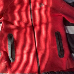 I’m selling a red Nike tech for 100$ size Large in kids I have a black one to